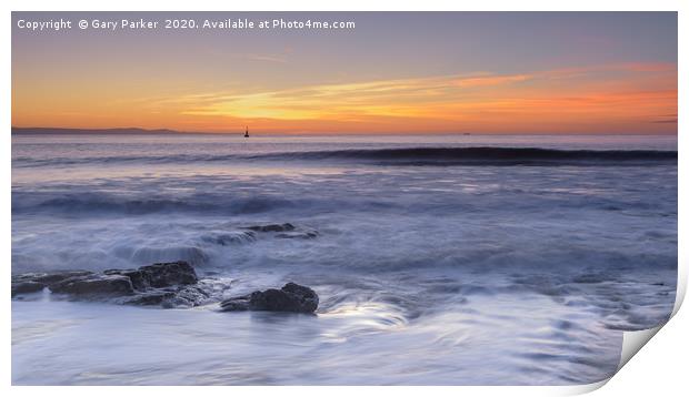 Waves rolling over rocks on the shoreline Print by Gary Parker