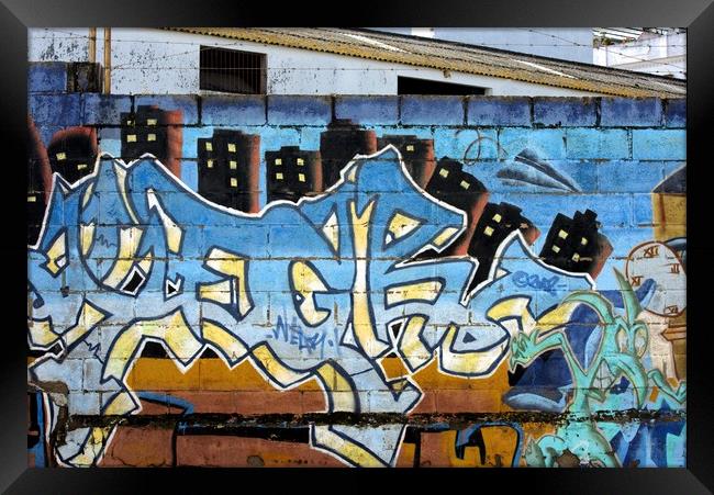 This is a graffiti painted on a wall in one of the Framed Print by Jose Manuel Espigares Garc