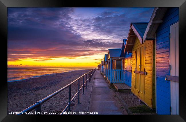 Sunrise over Cromer Beach Huts Framed Print by David Powley