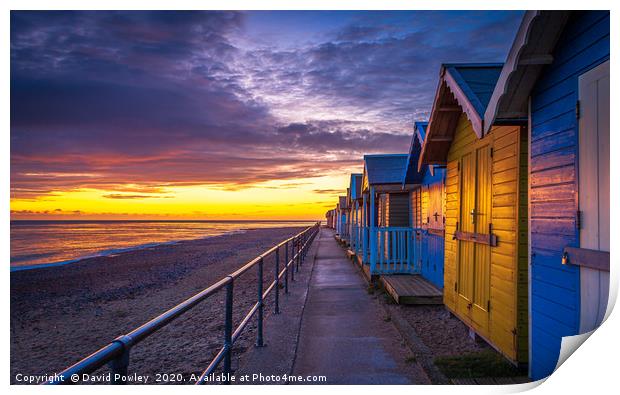 Sunrise over Cromer Beach Huts Print by David Powley