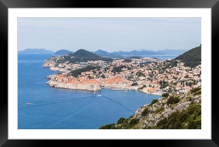 Tender boats moving between a cruise ship and Dubr Framed Mounted Print by Jason Wells