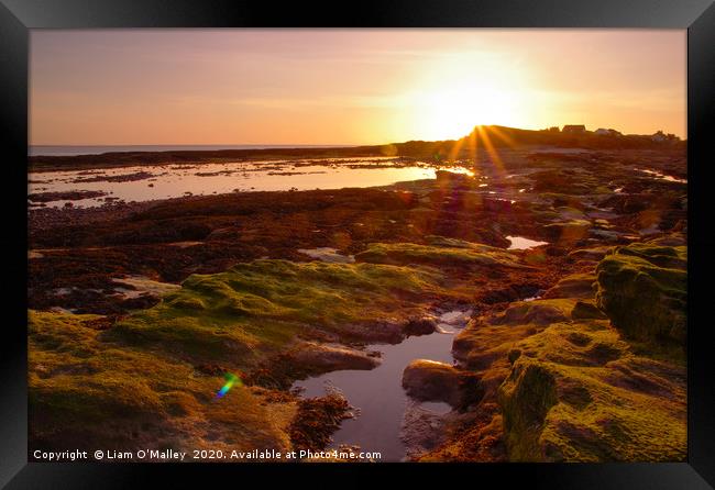 The Sun Sets on Hilbre island Framed Print by Liam Neon