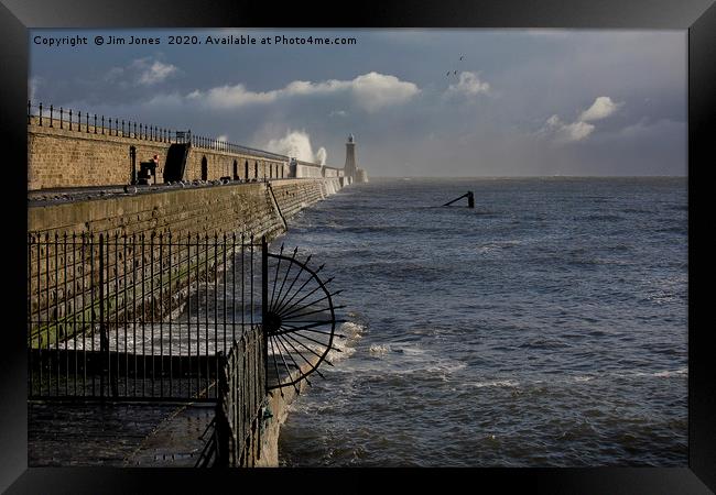 Waves splashing over Tynemouth Pier Framed Print by Jim Jones