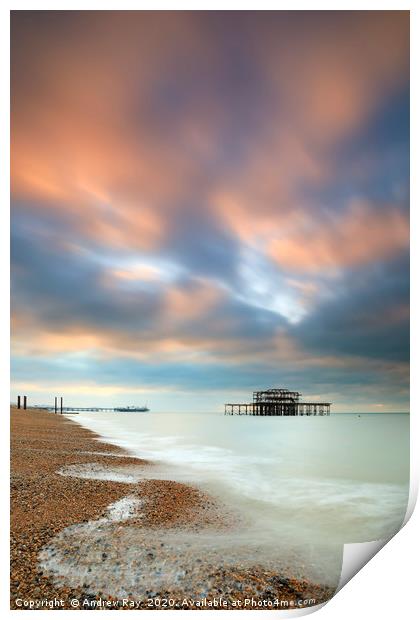Brighton Piers at sunrise Print by Andrew Ray