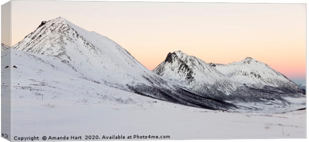 Winter Sun over Norwegian mountains Canvas Print by Amanda Hart
