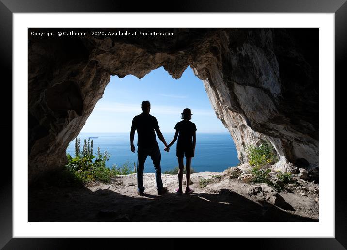 Silhouettes of tourists standing in the entrance o Framed Mounted Print by Rocklights 