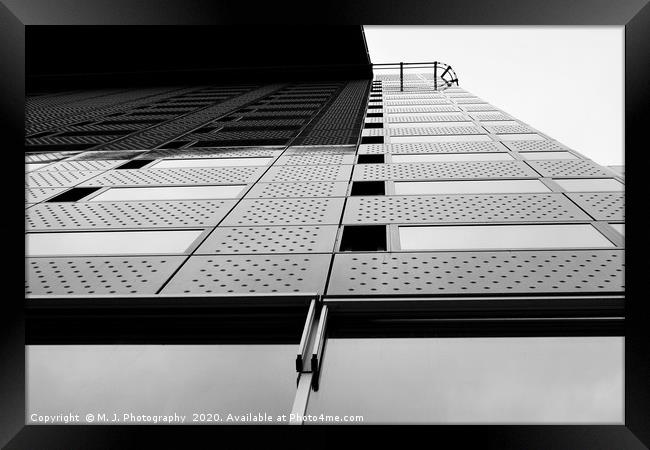 Modern and tall office buliding with sky over top Framed Print by M. J. Photography