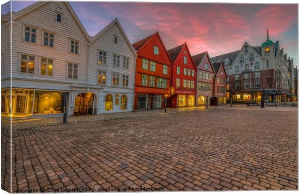 Historic charm at Bergen dawn Canvas Print by Clive Ingram