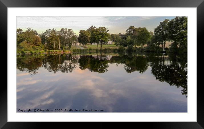Lovely tree surrounded lake somewhere in France Framed Mounted Print by Clive Wells