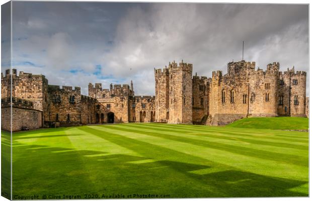 Majestic Alnwick Castle on a Moody Autumn Day Canvas Print by Clive Ingram
