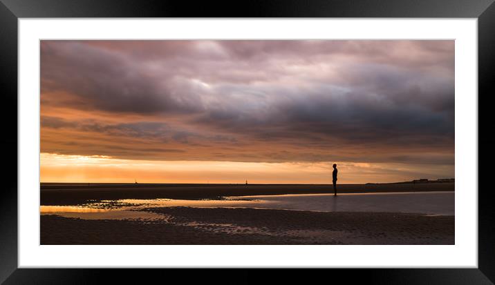 Iron Man under a stormy sky Framed Mounted Print by Jason Wells