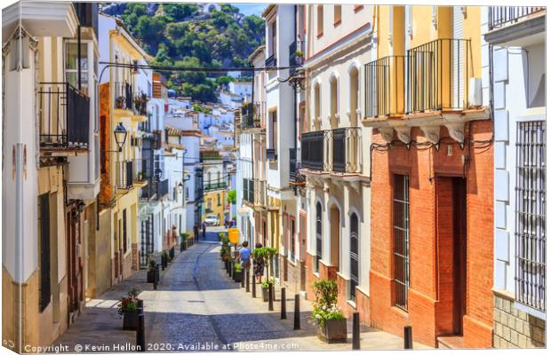 Narrow street in Ubrique, Spain Canvas Print by Kevin Hellon