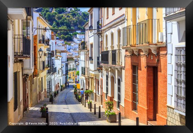 Narrow street in Ubrique, Spain Framed Print by Kevin Hellon