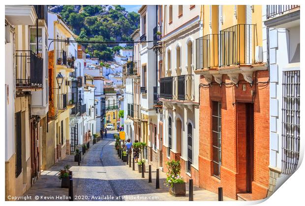 Narrow street in Ubrique, Spain Print by Kevin Hellon