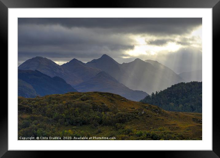 Crepuscular light rays over the Five Sisters Framed Mounted Print by Chris Drabble