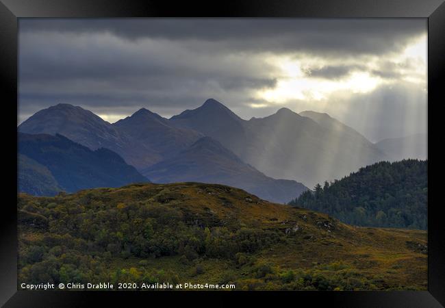 Crepuscular light rays over the Five Sisters Framed Print by Chris Drabble