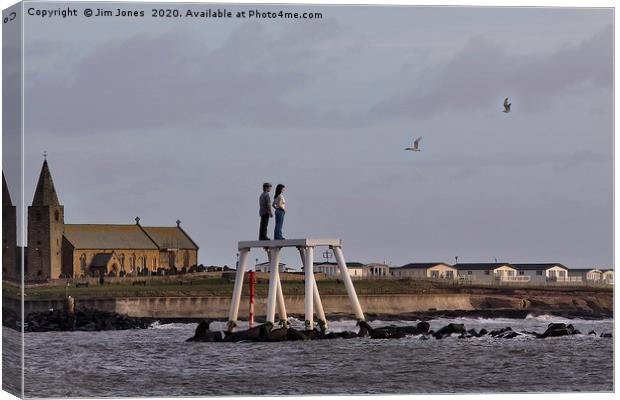 'The Couple' at Newbiggin by the Sea Canvas Print by Jim Jones