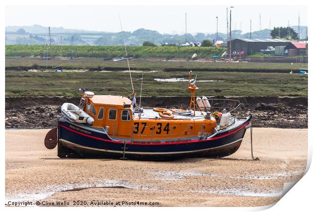 Lifeboat sitting on the mud flaps at Wells-Next-Se Print by Clive Wells