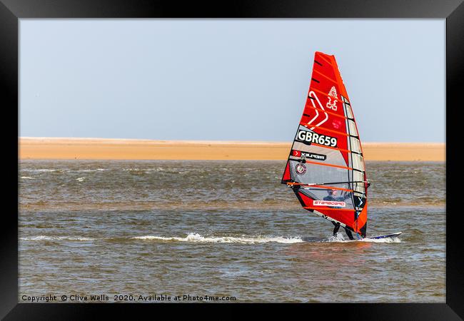 Wind surfing at Wells-Next-Sea in North Norfolk  Framed Print by Clive Wells