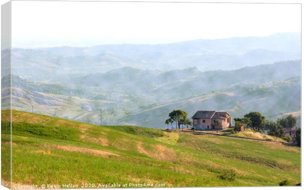 Farmhouse perched on top of a hill in the Emillia  Canvas Print by Kevin Hellon