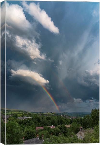 Summer storm over New Mills Canvas Print by John Finney