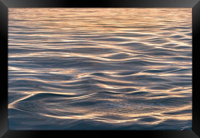 Close-up of soft sea waves at sea at sunset gold h Framed Print by RUBEN RAMOS