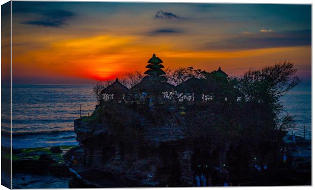 Sunset at Tanah Lot Temple, Bali. Canvas Print by John Hudson