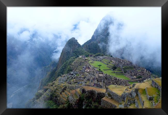 Machu Picchu in the mist Framed Print by Theo Spanellis