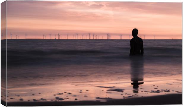 Iron Man watches out to sea at dusk Canvas Print by Jason Wells