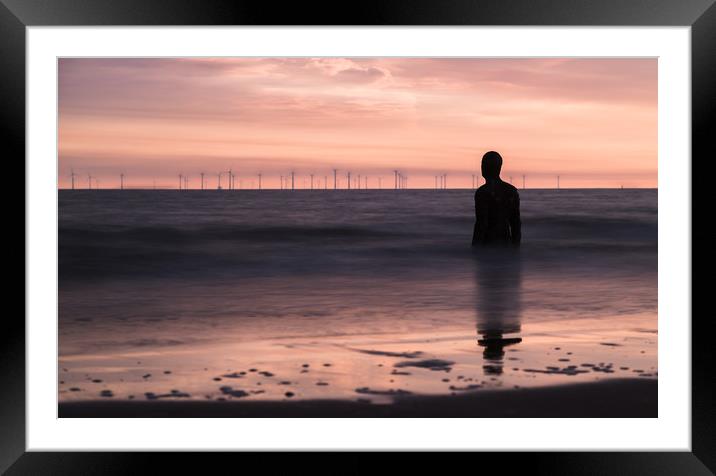 Iron Man watches out to sea at dusk Framed Mounted Print by Jason Wells