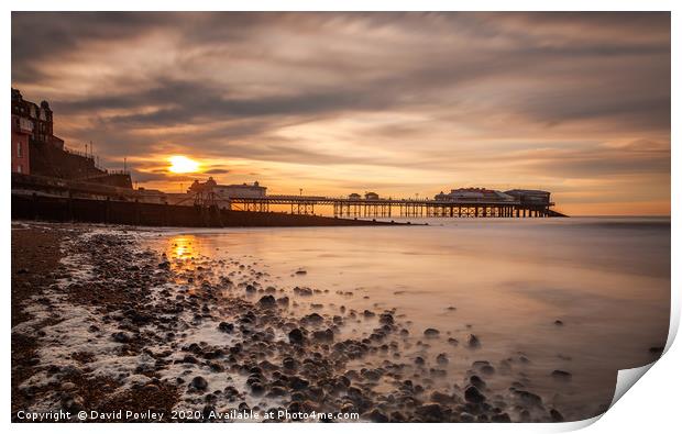 Evening light over Cromer Pier Print by David Powley