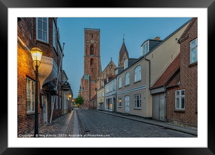The tower of Ribe cathedral at the end of an old s Framed Mounted Print by Stig Alenäs