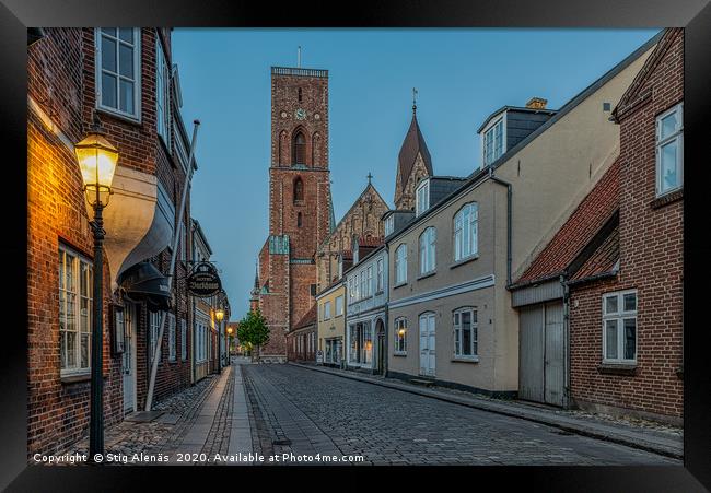 The tower of Ribe cathedral at the end of an old s Framed Print by Stig Alenäs