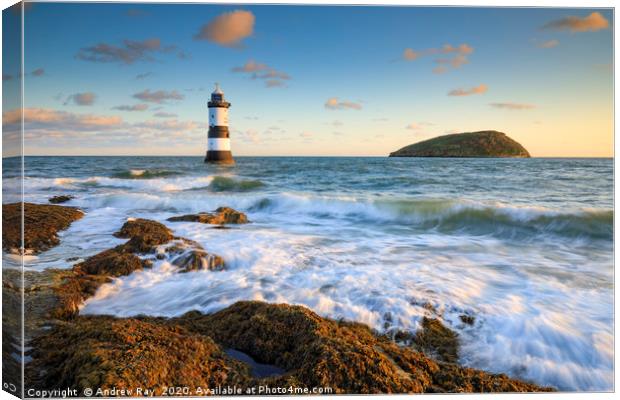 Incoming waves (Penmon Lighthouse) Canvas Print by Andrew Ray
