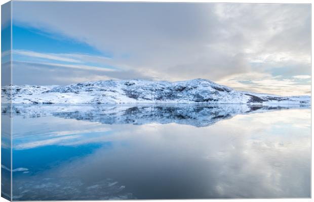 Norway - snow on an island in a smooth sea Canvas Print by Dave Collins