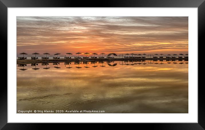sunbeds and parasols in a long row at sunset  Framed Mounted Print by Stig Alenäs