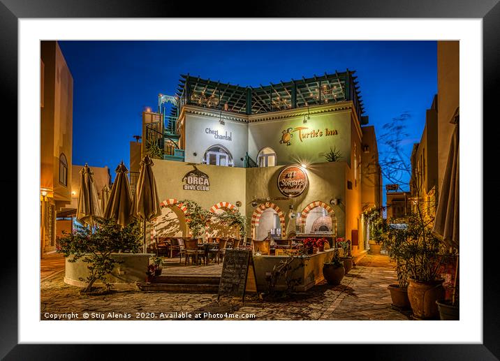 A colourful picturesque restaurant illuminated at  Framed Mounted Print by Stig Alenäs