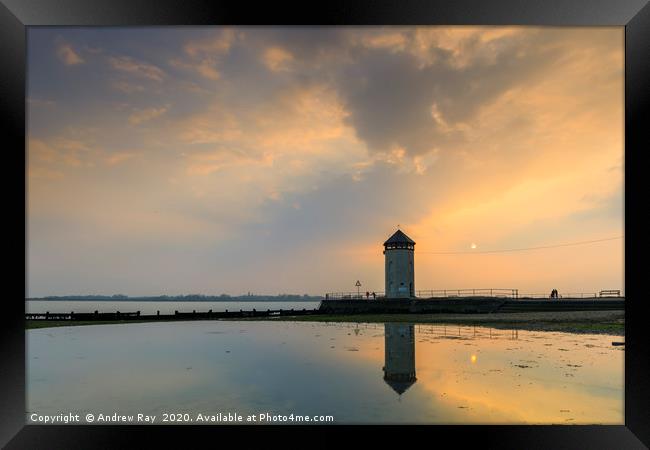 The setting sun behind Batemans Tower (Brightlings Framed Print by Andrew Ray