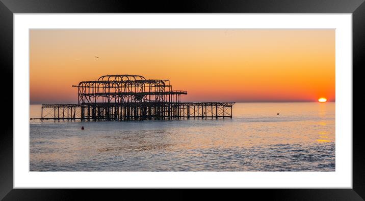 Old Brighton Pier in the sunset Framed Mounted Print by Erik Lattwein