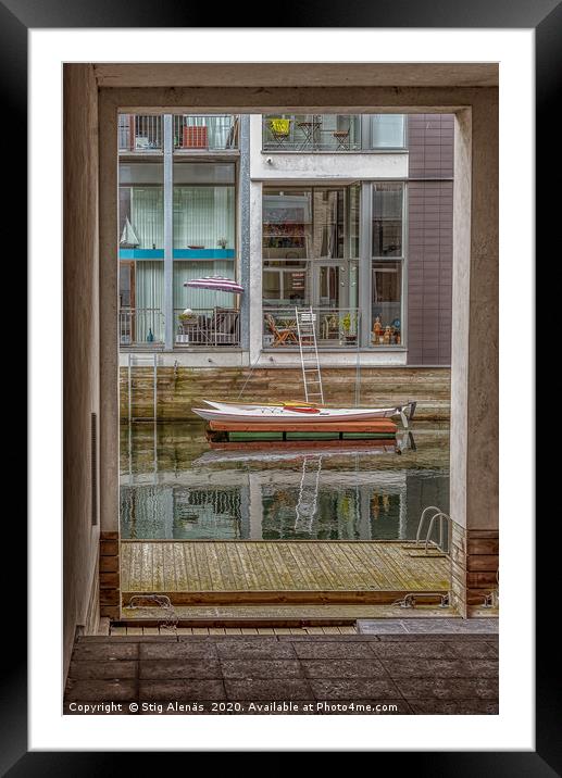 Passage through a tunnel to a canal with kayaks ou Framed Mounted Print by Stig Alenäs