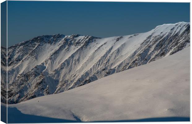 Winter Mountaineering Canvas Print by John Malley