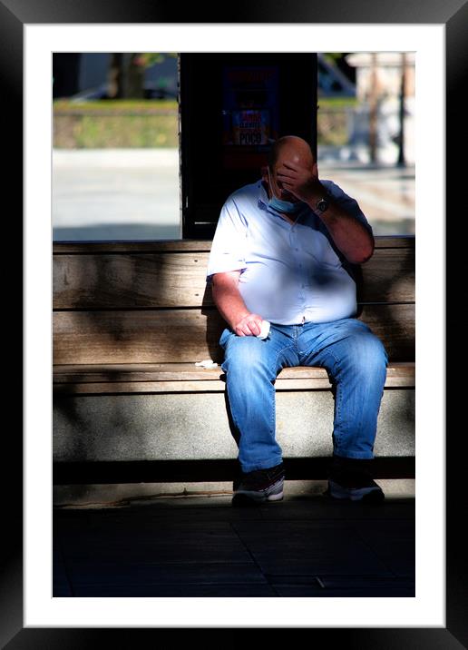 The fat man is sitting outdoors (on a seat). He is Framed Mounted Print by Jose Manuel Espigares Garc