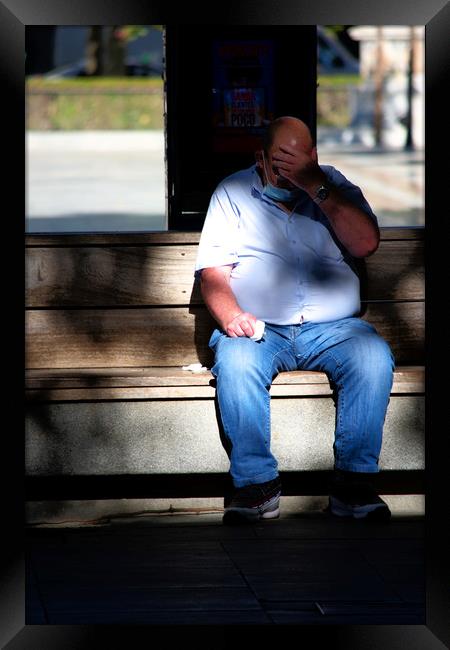 The fat man is sitting outdoors (on a seat). He is Framed Print by Jose Manuel Espigares Garc