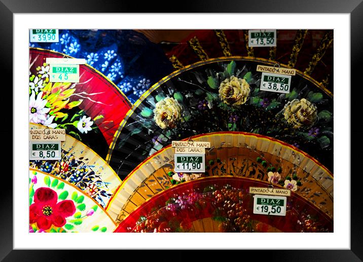 This a snapshot of some colorful fans in a shop wi Framed Mounted Print by Jose Manuel Espigares Garc