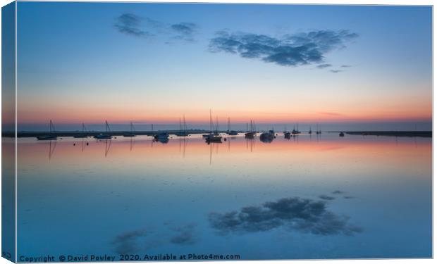 Misty dawn at Brancaster Staithe Canvas Print by David Powley