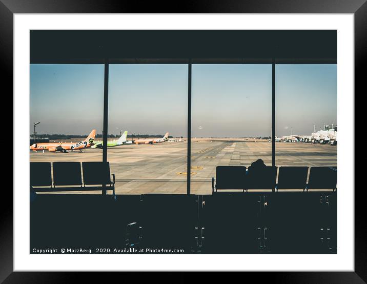 Looking out across the runway Framed Mounted Print by MazzBerg 
