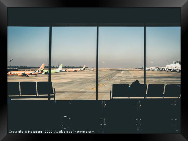 Looking out across the runway Framed Print by MazzBerg 