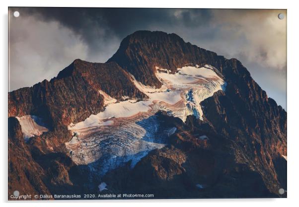 Sunset light shines on peak of mountain Roche de l Acrylic by Dalius Baranauskas