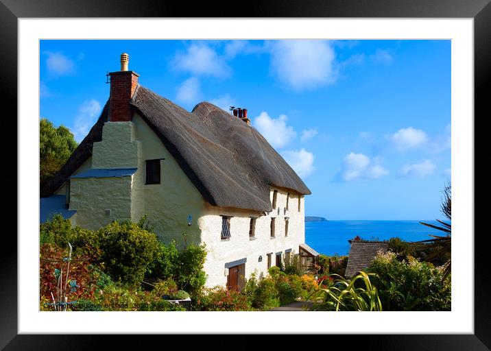 thatched cottage cornwall, england Framed Mounted Print by Kevin Britland