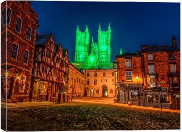 Lincoln Cathedral lit up green Canvas Print by Andrew Scott